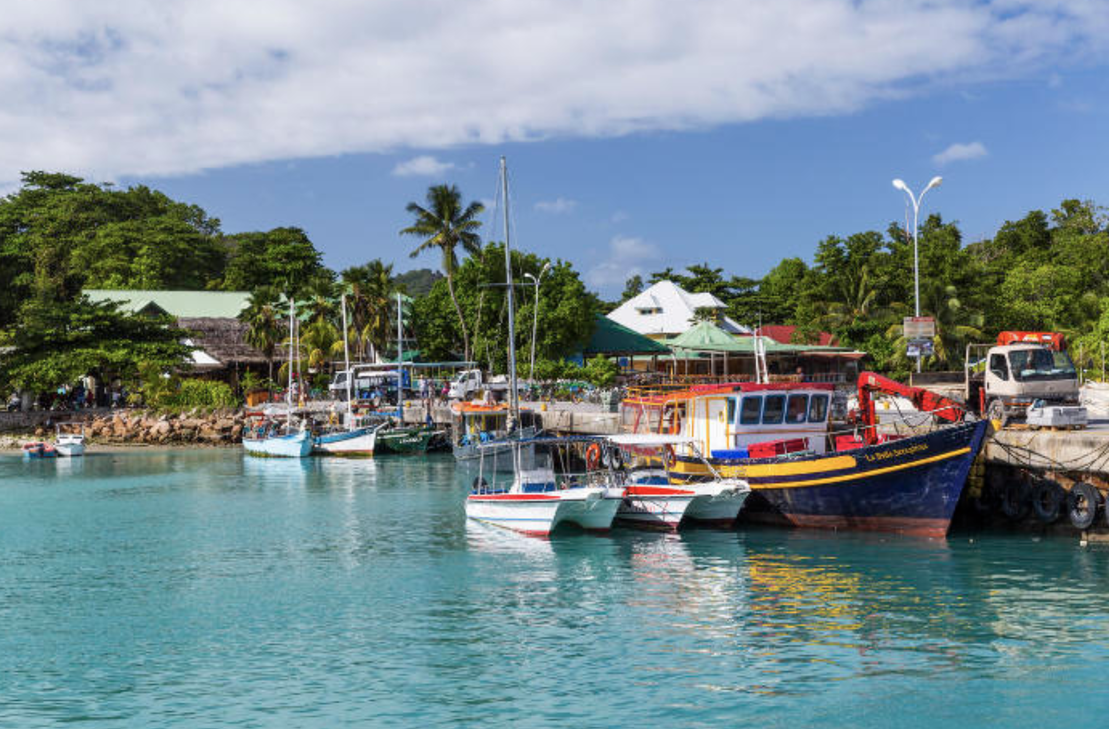 fishing boats in seychelles coastal landscape