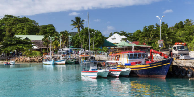fishing boats in seychelles coastal landscape